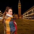 Woman looking into distance standing near St Marks Campanile Royalty Free Stock Photo