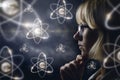 Woman looking explores atoms . Royalty Free Stock Photo