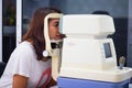 Woman looking at eye test Royalty Free Stock Photo