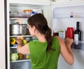 Woman looking in fridge Royalty Free Stock Photo