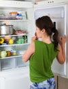 Woman looking in fridge Royalty Free Stock Photo