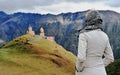 Woman looking at Gergeti old church