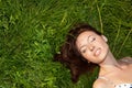 Woman looking happy and smiling on grass Royalty Free Stock Photo