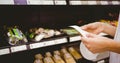 A woman looking at her grocery list Royalty Free Stock Photo