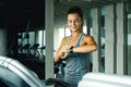 Woman is looking on her smar watches in gym