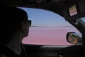 Woman looking at Hutt Lagoon Pink lake at Port Gregory in Western Australia Royalty Free Stock Photo