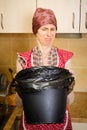 Woman Looking inside a Trash Can Royalty Free Stock Photo