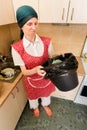 Woman Looking inside a Trash Can Royalty Free Stock Photo