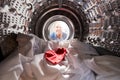 Woman Looking Inside Washing Machine With Red Sock Mixed With White Laundry