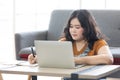 Woman looking at laptop computer and writing on notebook for work or study Royalty Free Stock Photo