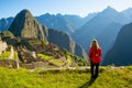 Woman looking at Machu Picchu at sunrise Royalty Free Stock Photo