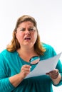 Woman looking through magnifying glass Royalty Free Stock Photo