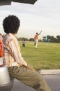 Woman Looking At Man And Child Playing With Kite Royalty Free Stock Photo