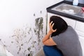 Woman Looking At Mold On Wall Royalty Free Stock Photo