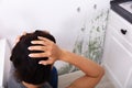 Woman Looking At Mold On Wall Royalty Free Stock Photo