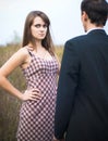 Woman looking offended over man shoulder Royalty Free Stock Photo