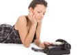 Woman looking at old phone waiting for a call Royalty Free Stock Photo