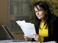 Woman looking over paperwork Royalty Free Stock Photo