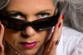 Woman looking over sunglasses Royalty Free Stock Photo