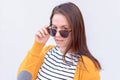 Woman looking over sunglasses Royalty Free Stock Photo