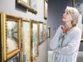 Woman looking at picture collection