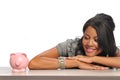 Woman looking at a piggy bank Royalty Free Stock Photo