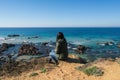 Woman looking at Praia da Samoqueira