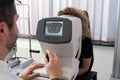 Woman Looking at Refractometer Eye Test Machine Royalty Free Stock Photo