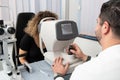 Woman Looking at Refractometer Eye Test Machine Royalty Free Stock Photo