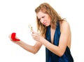 Woman looking at ring through magnifier