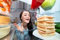 Woman Looking At Sandwich In Refrigerator Royalty Free Stock Photo