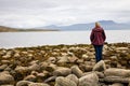 Woman looking at sea, Scotland