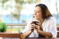 Woman looking at side in an apartment balcony