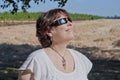 Woman looking at the solar eclipse with eclipse glasses