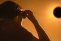 Woman is looking on solar eclipse through three sunglasses. Royalty Free Stock Photo