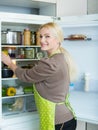 Woman looking for something in fridge Royalty Free Stock Photo