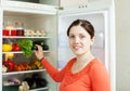 Woman looking for something in fridge Royalty Free Stock Photo