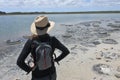 Woman looking at Stromatolites in Lake Thetis Cervantes Western Australia