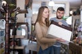 Woman looking for stylish knickknacks for apartment in shop Royalty Free Stock Photo