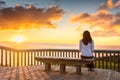 Woman looking at sunset at Hallett Cove boardwalk