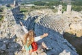 Woman looking at theater of Xanthos ancient city