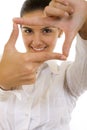A woman looking threw her fingers Royalty Free Stock Photo