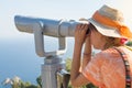 Woman looking thru binoculars at the horizon. Royalty Free Stock Photo