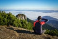 Woman looking to the horizon in the mountains