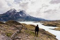 woman looking toward awesome view of Torres del Paine mountain range Royalty Free Stock Photo