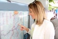 Woman looking on transport map in the city