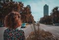 Woman looking at the twin towers in Barcelona, seen from behind Royalty Free Stock Photo