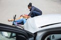 Woman Looking At Unconscious Male Cyclist Lying On Street Royalty Free Stock Photo