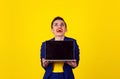 Woman looking up laughing holding computer laptop Royalty Free Stock Photo