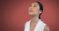 Woman looking up with red background Royalty Free Stock Photo